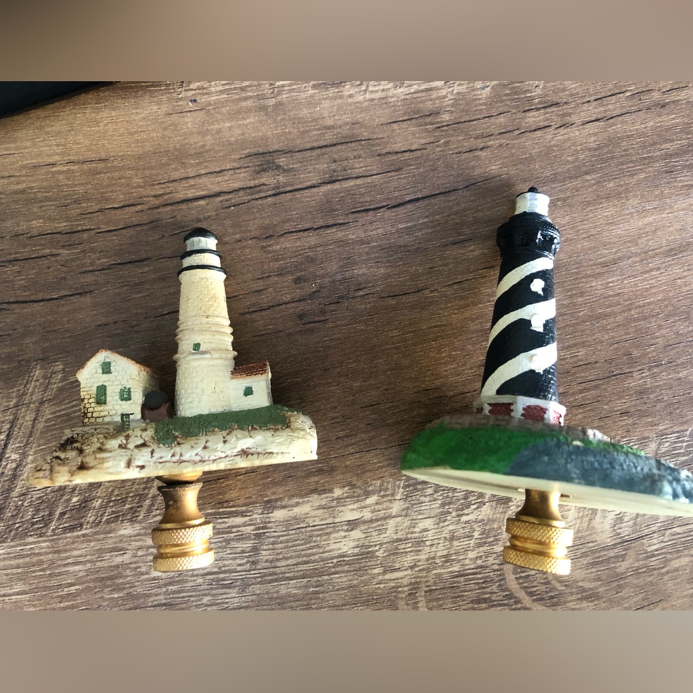 A pair of screw on lighthouse lamp topper